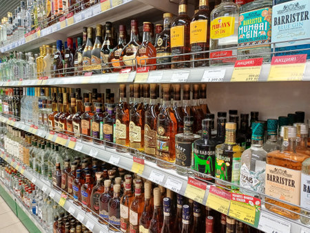 Many bottles of alcoholic drinks on the store shelf. Moscow. Russia. February 13, 2024.のeditorial素材