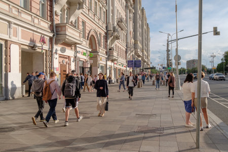 Pedestrians walk along a city street on a summer day. Moscow. Russia. June 30, 2024.のeditorial素材