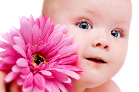 portrait of beautiful baby girl with flowerの写真素材