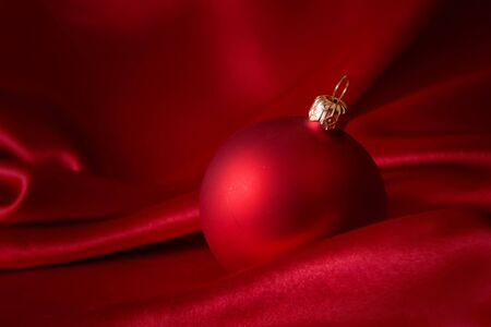 christmas card with red ornament on the satinの写真素材