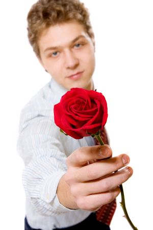 portrait of young businessman with red roseの写真素材