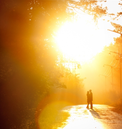 beautiful shot of kissing couple in the sunlightの写真素材