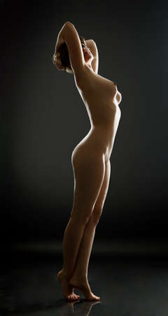 beautiful naked woman on black backgroundの写真素材