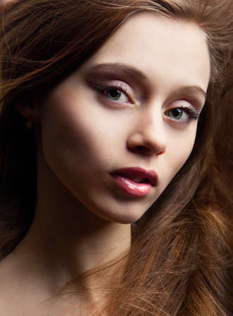 portrait of beautiful fashionable woman on dark backgroundの写真素材