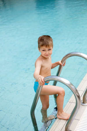Portrait of little boy in the swimming poolの写真素材