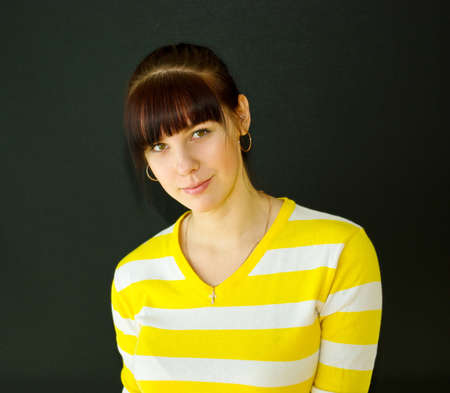 Attractive young woman on black backgroundの写真素材