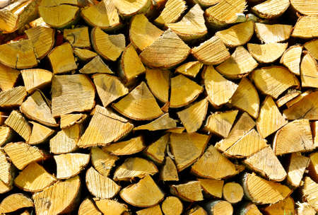 Stack of different size firewood for background