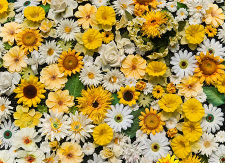 Garden fence made of different summer flowersの写真素材