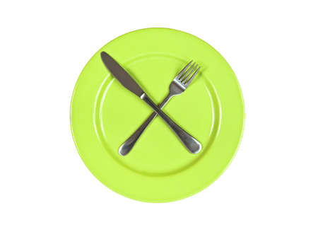 Fork and knife on plate isolated on whiteの写真素材