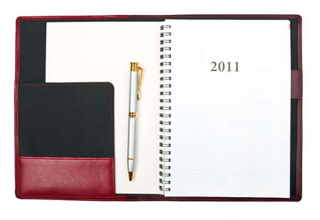 Open diary for year 2011 and pen over whiteの写真素材