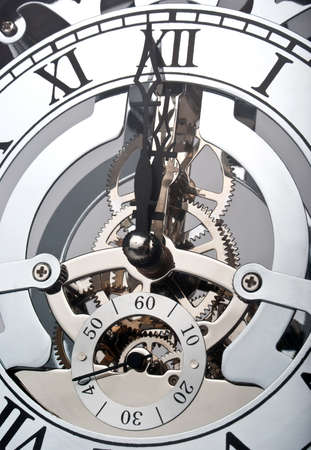 Clock showing time one minute before twelveの写真素材