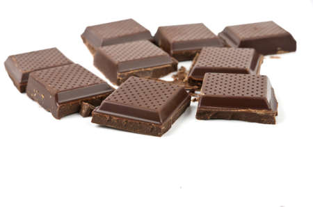 Broken chocolate bar isolated on white background.