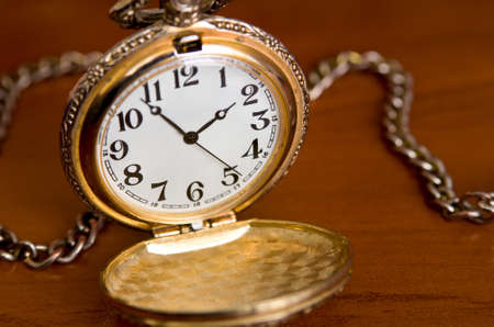 Open pocket watch on tableの写真素材