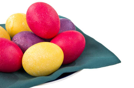 Colored easter eggs on saucer isolated on whiteの写真素材