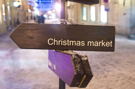 Wooden sign leading to Christmas Marketの写真素材