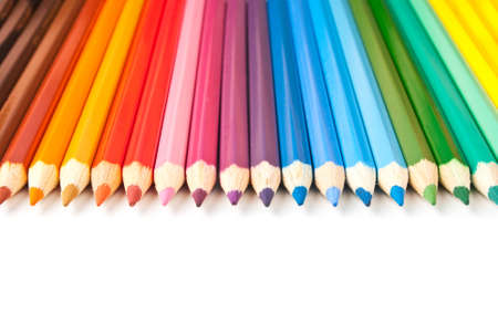 Color pencils in row over white backgroundの写真素材