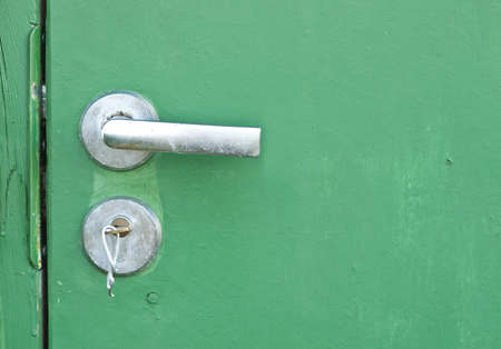 Handle and lock in green doorの写真素材