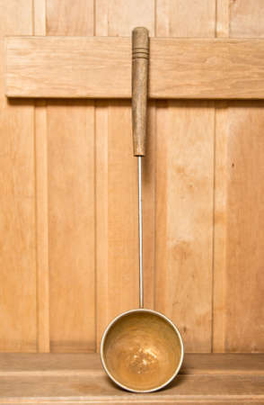 Old rusty sauna ladleの写真素材