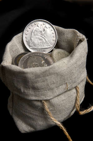 Old silver dollar of USA isolated on blackの写真素材