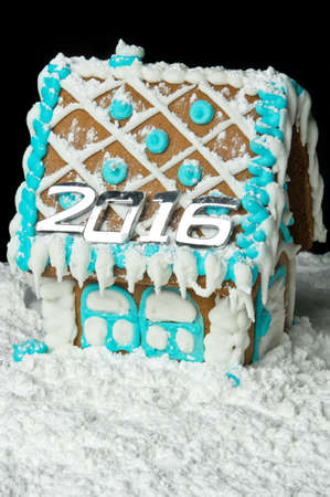Gingerbread house with number 2016 on the roof