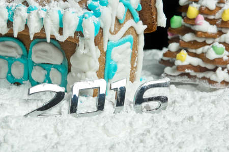 Gingerbread house and numbers for New Year 2016.の写真素材
