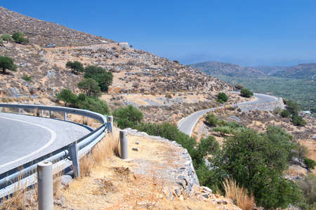 Winding road in mountains of Crete island, Greeceの写真素材