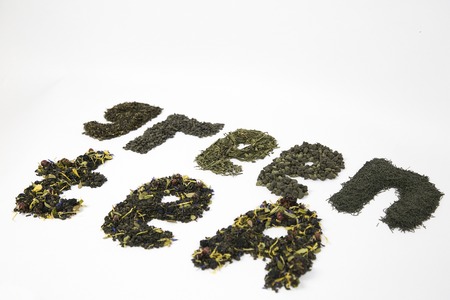 TEA - inscription from green flavored tea on a white backgroundの写真素材