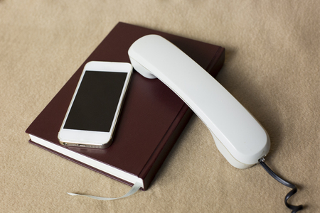 Old telephone and mobile,concepts compare new and old technologies.の写真素材