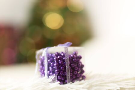 Decoration on a Christmas tree, beads of different colors in a gift boxの写真素材