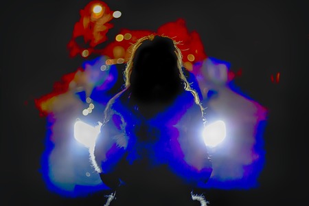 Girl at night in the car headlights