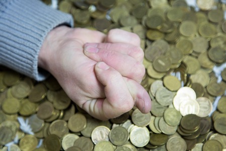 Combination of fingers on the hand against the background of money. The man's hand from the fingers depicts the refusal and lack of money.の写真素材
