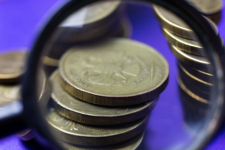Coins through a magnifying glass. A look at the mettalical money through the increase in the microscope.の写真素材
