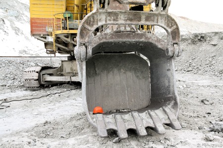 Bucket excavator volume of 10 meters cubic. A close-up of a bucket of a large excavator in a quarry.の写真素材
