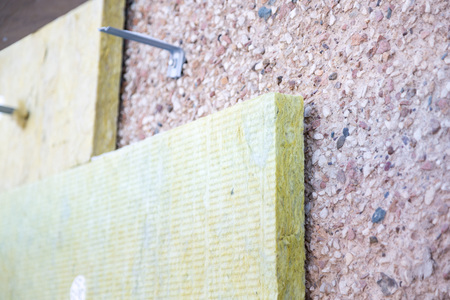 External repair work on the building, insulation and cladding of the facade of the houseの写真素材