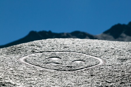 A magic symbol on a stone. Symbol of peace, extraterrestrial civilization, ancient writings