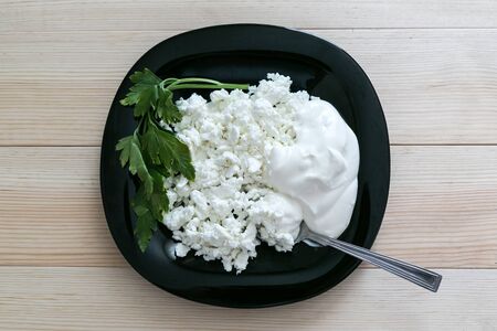 Breakfast menu - cottage cheese with green cream and green parsley. Sprig of parsley.の写真素材