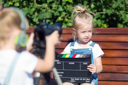 A couple of girls make a video for the Internet.の写真素材