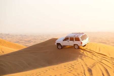Sports rally in sand dunes of the desert