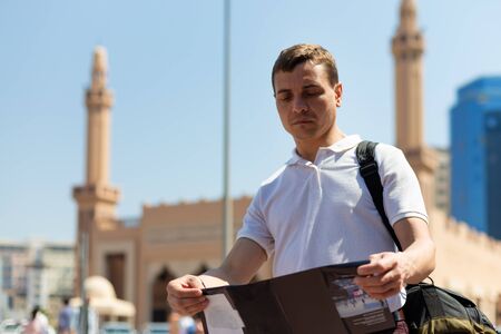 Caucasian tourist with map in eastern country A 35-40 year old tourist man with a map in his hands...