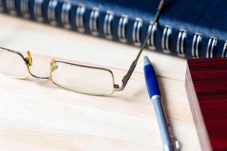 Creative person work desk glasses and notepad.,