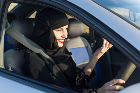 Woman car driver emotionally waving hands., Traditional clothingの写真素材