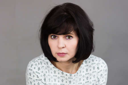 Gazing of a beautiful brunette adult woman.の写真素材