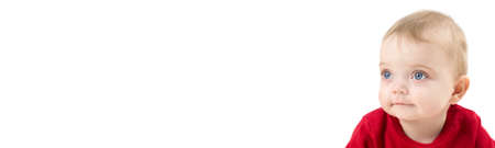 Child six months age isolate on white background, blank template for advertising banner.の写真素材