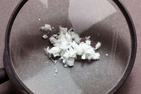 Hazardous mineral asbestos close up on black background. Black backgroundの写真素材