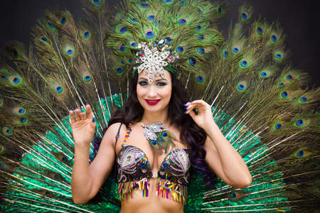 Woman oriental dancer in peacock feather costume.の写真素材
