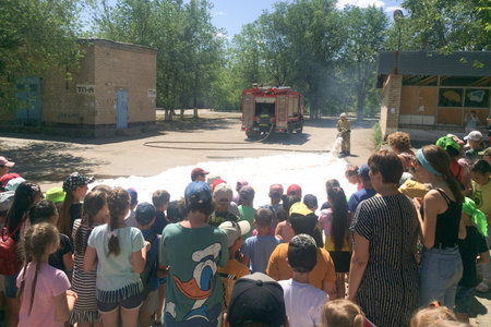 Orenburg, Russia - June 18, 2021 Children play in the foam. Soap show on the street. Editorial.のeditorial素材