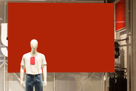 Men's manicure on a red advertising banner in the store, copy the space.の写真素材