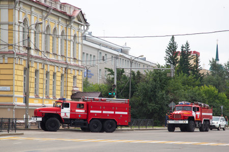 Irkutsk, Russia - July 31, 2021 Firefighting vehicles are on the way to an urgent call. Editorial.