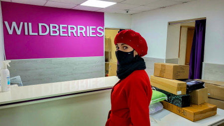 Orenburg, Russia - October 28, 2021 Woman shopper in store Wildberries. Editorial.のeditorial素材