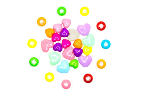 Accessories for needlework in the form of bright colored hearts on a white background.の写真素材
